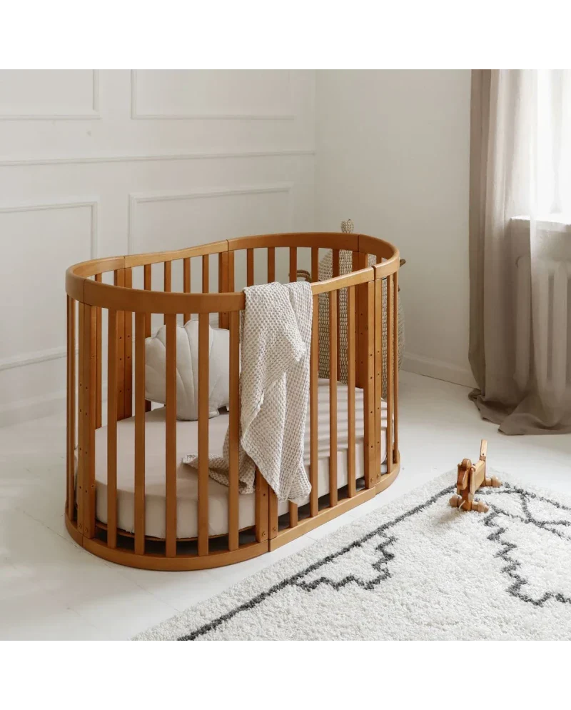 Babybett 7-in-1 – Ein Bett für viele Jahre - mitwachsend | Ovale Form